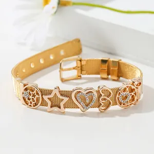 Golden mesh strap bracelet with hollow stars, hearts, and rhinestones on white background