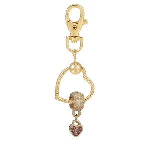 Porte-clés cœur doré avec perle rose et pendentif cadenas cœur en strass rose