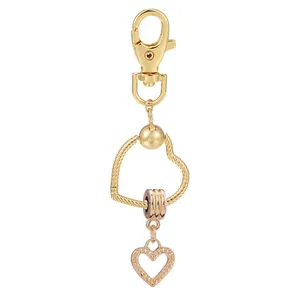 Porte-clés Attrape-rêves Cœur en Alliage Métal Plaqué Or Anneau Torsadé Pendentif de Sac pour Femme Cadeau de Saint Valentin