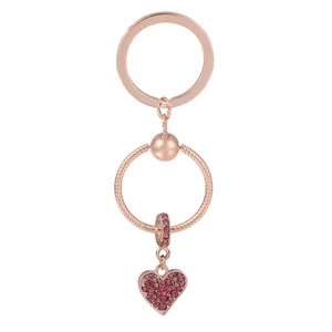 Rose gold heart dreamcatcher keychain with pink crystals on a white background