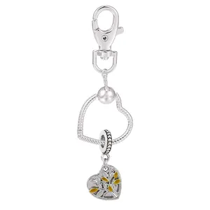 Porte-clés plaqué argent avec cadre en cœur et pendentif arbre de vie jaune