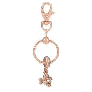Porte-clés étoile de mer en or rose avec fermoir mousqueton et pendentif en cristal