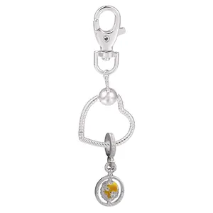 Porte-clés cœur en alliage argenté avec pendentif globe doré rotatif et fermoir mousqueton