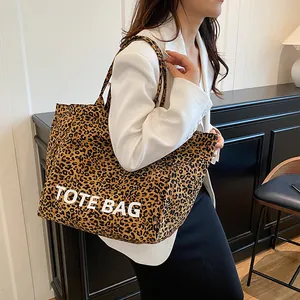 Stylish large capacity leopard print tote bag for women shown with a modern outfit