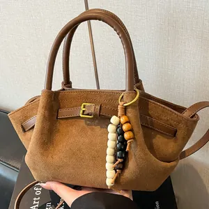 Brown frosted suede handbag with vintage leather straps and bohemian wooden bead tassel