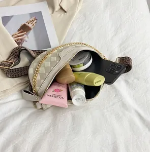 Detail view of beige checkered crossbody bag interior showing spacious daily storage capacity