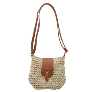 Fashionable woven straw crossbody bag with brown leather flap and vintage metal buckle
