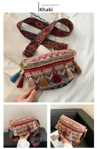 Detail of bohemian woven bag featuring colorful tassels and ethnic geometric embroidery