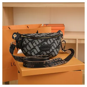 Detailed close-up of fashion waist bag with letter patterns and wide jacquard strap