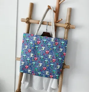 Detail of the colorful owl print on the durable canvas tote bag with thick cotton handles