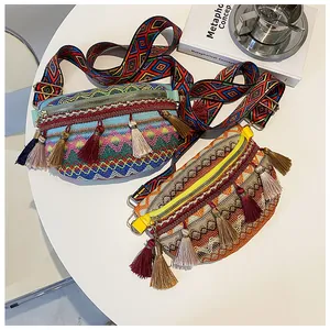 Detail view of colorful bohemian woven crossbody bags with multi-colored fringe tassels