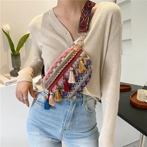 Bohemian colorful woven crossbody bag with vibrant tassels and wide geometric strap