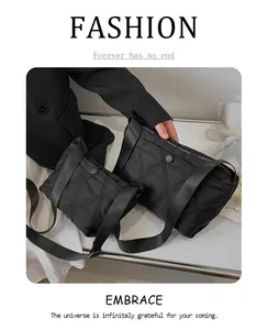 Close-up of black quilted nylon crossbody bags with Forever Young logo and snap button