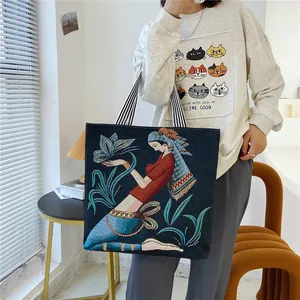 Grande borsa tote in arazzo con ritratto jacquard e manici a righe
