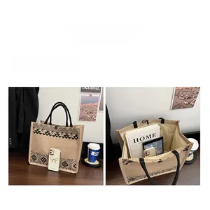 Detail of jute tote bag showing spacious interior capacity with black geometric pattern