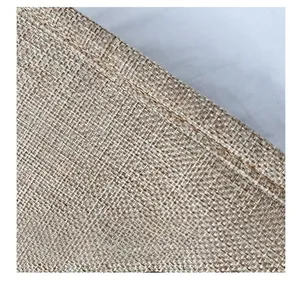 Detailed macro view of heavy linen fabric weave and reinforced stitching on the tote bag