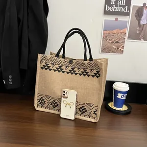 Close-up of geometric pattern burlap tote bag with snap button closure and sturdy handles