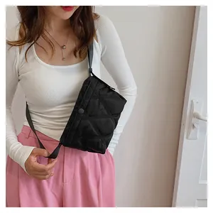 Detail of black quilted shoulder bag featuring premium texture and large capacity