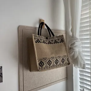 Close-up of ethnic geometric pattern on large linen tote bag with sturdy rope handles