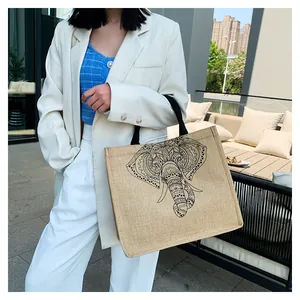 Outdoor shot of a linen tote bag with elephant print showing its large capacity and texture