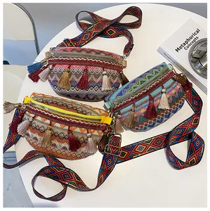 Detailed view of woven ethnic chest bags with colorful fringe tassels and jacquard straps