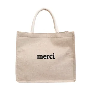 Sac fourre-tout minimaliste en jute naturelle avec imprimé merci noir et anses