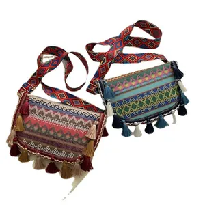 Ethnic bohemian woven crossbody bags with colorful tassels and adjustable wide straps