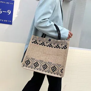 Ethnic style jute tote bag with black geometric patterns and large capacity for women