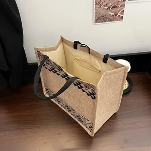 Ethnic style large jute tote bag with black geometric patterns and spacious interior
