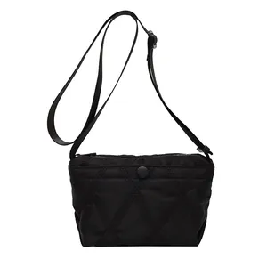 Chic black quilted crossbody dumpling bag with adjustable nylon strap and large capacity
