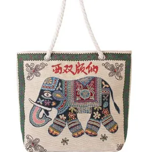 Ethnic style embroidered elephant canvas tote bag with woven rope handles in white
