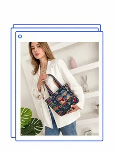 Close-up of ethnic style navy knit tote bag with colorful owl pattern and fabric handle