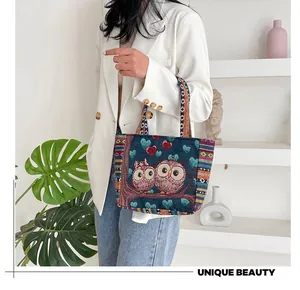 Detail of owl jacquard knitting on tote bag with unique ethnic embroidery and colorful stripes