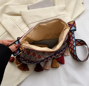 Detailed interior view of ethnic crossbody bag showing storage capacity and zipper