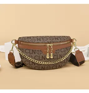 Detail of brown monogram belt bag showing gold chain accents and adjustable strap