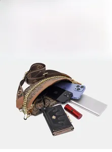 Detailed view of the brown monogram crossbody bag showing large internal capacity with essentials