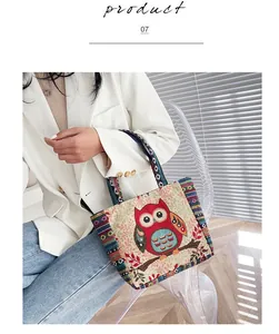 Detail of vintage ethnic knit tote bag featuring a red owl pattern and colorful handles