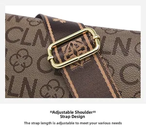 Detail of adjustable woven shoulder strap with gold buckle on printed leather bag