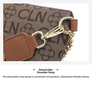 Detail of the detachable leather strap and golden metal buckle on monogram chain bag