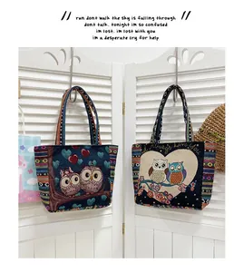 Macro detail of knit tote bag showing owl embroidery and colorful striped strap