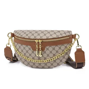 Detail of vintage monogram fanny pack with golden chains and adjustable strap