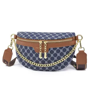 Navy blue monogram crescent chest bag with gold chain and jacquard shoulder strap