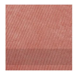 Close-up of soft pink corduroy fabric texture showing fine ribbed material detail