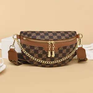Brown checkered crossbody chest bag with gold chain and logo on neutral studio background