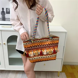 Ethnic bohemian woven tote bag with colorful tassels and twisted rope handles