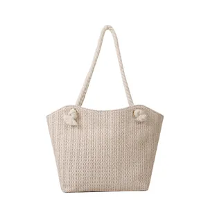Large beige woven straw tote bag with cotton rope handles for summer beach fashion