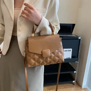 Caramel retro quilted leather handbag for women with woven handle and shoulder strap