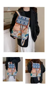 Detail of bohemian elephant embroidered drawstring backpack with colorful patterns