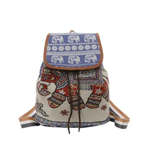 Detailed close-up of ethnic embroidered elephant pattern and jacquard canvas texture