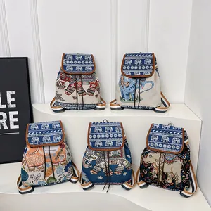 Detailed embroidery on bohemian drawstring backpacks with artistic elephant patterns